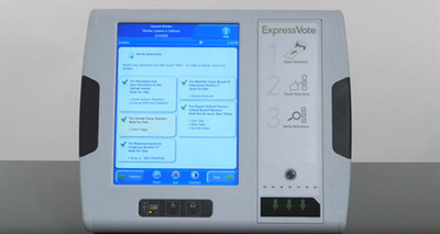 White ExpressVote voting machine sits on table with white and blue display screen showing voter's selections
