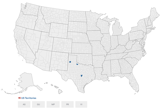 US map showing counties using the eSlate DRE voting machine in blue. A few counties in Texas are highlighted